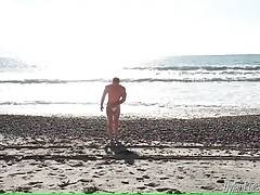 Tough fellow Adam Hardy takes sunbath at the beach.